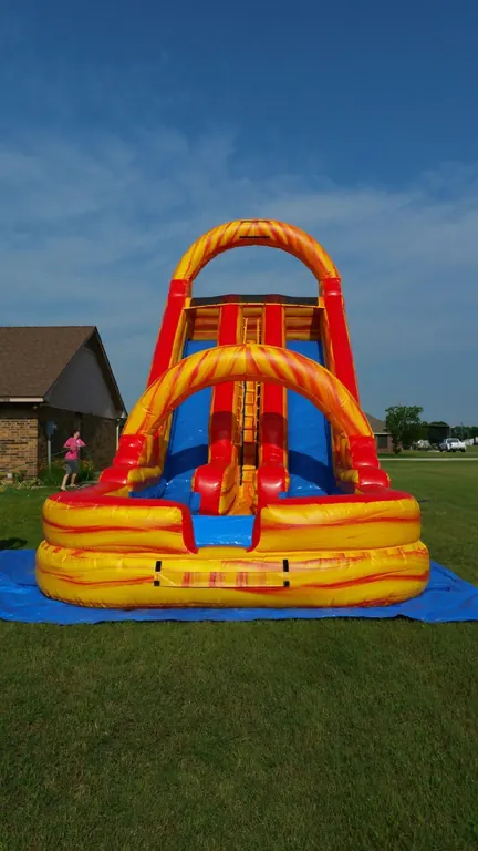 Orange and blue inflatable water slide rental