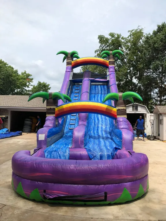 Purple tropical inflatable water slide rental